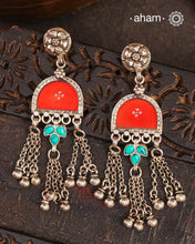 Statement Rang Mahal red earrings with dangling charms, handcrafted in 92.5 sterling silver. The magic that happens when glass, silver and a pop of colour come together.