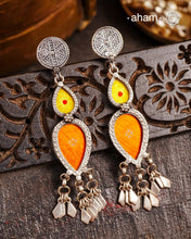 Statement Rang Mahal orange and yellow drop earrings with dangling charms, handcrafted in 92.5 sterling silver. The magic that happens when glass, silver and a pop of colour come together.