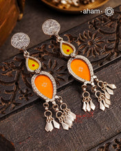 Statement Rang Mahal orange and yellow drop earrings with dangling charms, handcrafted in 92.5 sterling silver. The magic that happens when glass, silver and a pop of colour come together.