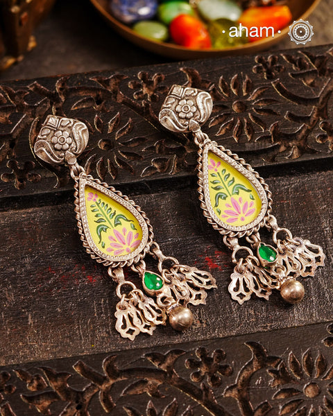 Statement Rang Mahal earrings with dangling charms, handcrafted in 92.5 sterling silver. The magic that happens when glass, silver and a pop of colour come together.