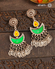 Statement Rang Mahal green &amp; yellow diya earrings with dangling charms, handcrafted in 92.5 sterling silver. The magic that happens when glass, silver and a pop of colour come together.