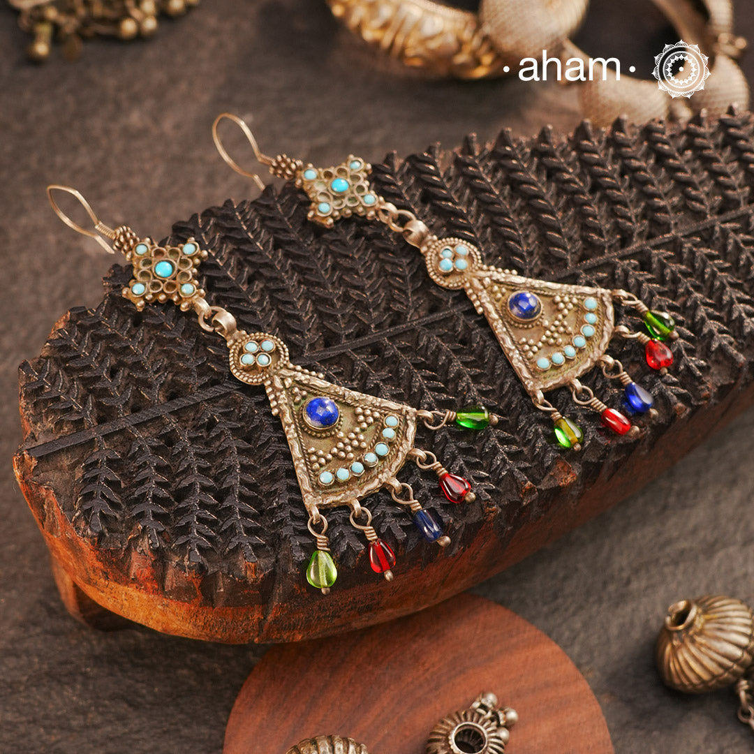 The earrings are sourced from the Turkmen central Asia regions. The dents, the marks, the irregularities all add to the charm and tell a story of where they comes from.