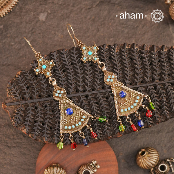 The earrings are sourced from the Turkmen central Asia regions. The dents, the marks, the irregularities all add to the charm and tell a story of where they comes from.