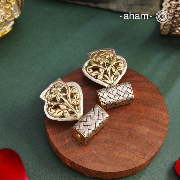 Contemporary two tone earrings handcrafted in 92.5 sterling silver with floral chitai work. These earrings look elegant paired with any outfit from Dawn to Dusk.