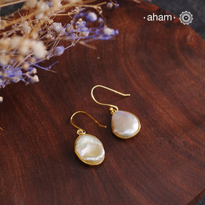 Shimmer and shine with these Mother of Pearl Gold Polish Silver Earrings! The natural mother of pearl is set in stylish silver with a touch of gold polish. The easy fishhook makes them light weight and a perfect go-to for any outfit. Dress them up or down, they'll be your new fave!

Keep in mind that these are natural forms, so both earrings in the set will have a similar shape, but not an exact match.