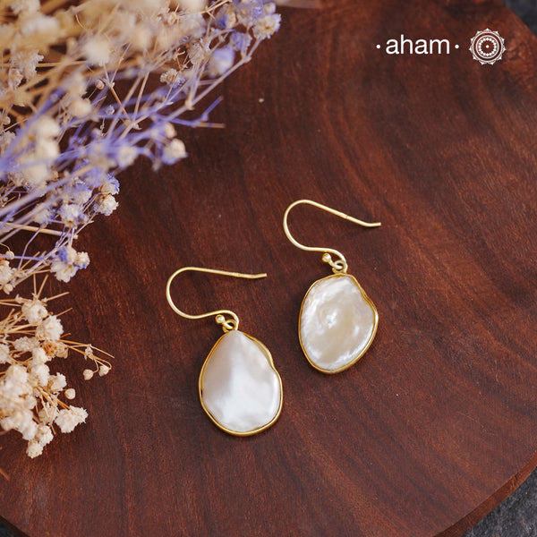 Shimmer and shine with these Mother of Pearl Gold Polish Silver Earrings! The natural mother of pearl is set in stylish silver with a touch of gold polish. The easy fishhook makes them light weight and a perfect go-to for any outfit. Dress them up or down, they'll be your new fave!


Keep in mind that these are natural forms, so both earrings in the set will have a similar shape, but not an exact match.