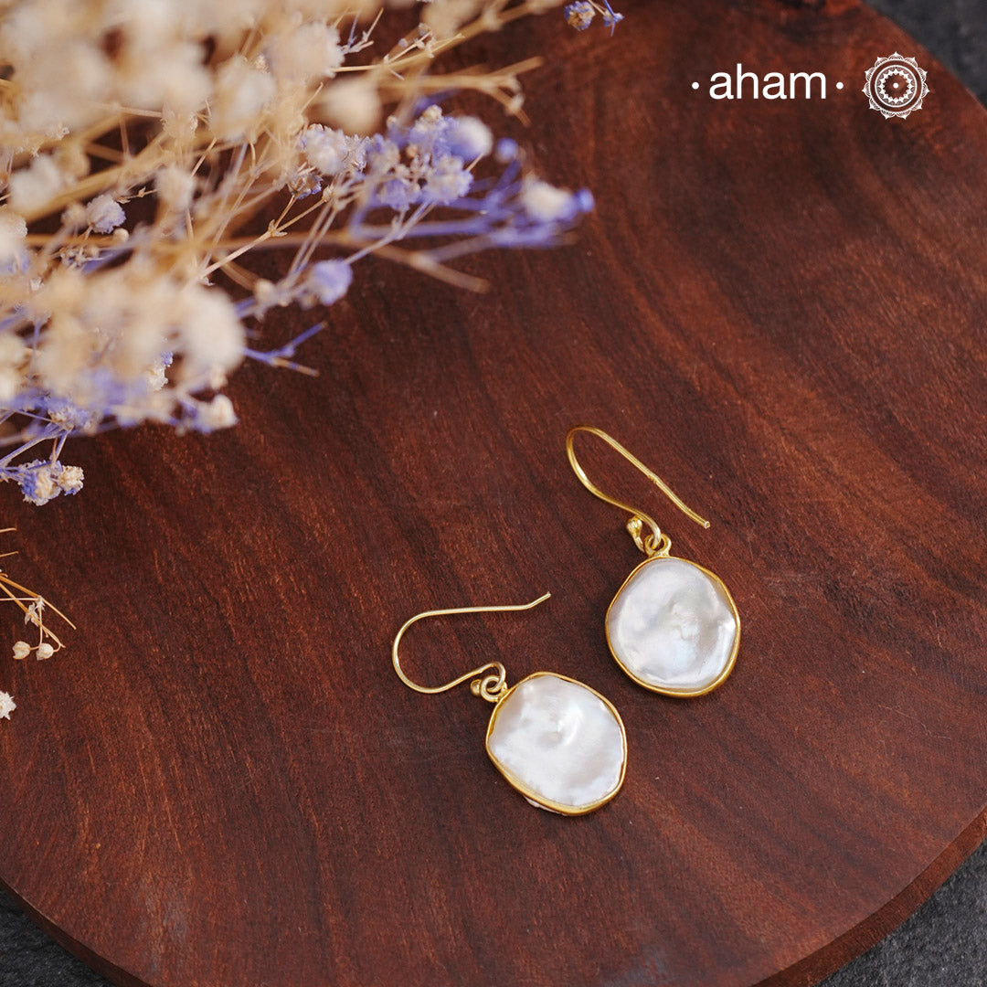 Shimmer and shine with these Mother of Pearl Gold Polish Silver Earrings! The natural mother of pearl is set in stylish silver with a touch of gold polish. The easy fishhook makes them light weight and a perfect go-to for any outfit. Dress them up or down, they'll be your new fave!


Keep in mind that these are natural forms, so both earrings in the set will have a similar shape, but not an exact match.