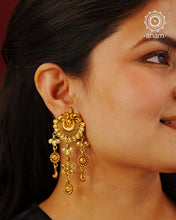 Handcrafted 92.5 Silver Earrings with antique Gold Polish Handcrafted with precision and timeless elegance in mind, these 92.5 silver earrings are carefully adorned with an antique gold polish. The result is a stunning and sophisticated piece of jewelry that will elevate any outfit, making you stand out with its unique charm