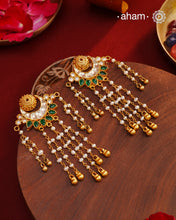 Handcrafted gold polish kundan chand earrings with dangling cultured pearls. Crafted using&nbsp;traditional techniques in 92.5 sterling silver with&nbsp;green stone highlights. Perfect for&nbsp;special occasions&nbsp;and upcoming festive celebrations.&nbsp;