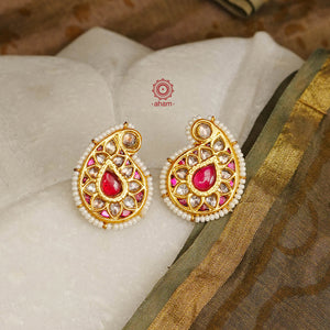 Feel like royalty when dressed in these Kundan Paisley Silver Earrings with semi precious stones and cultured pearls. Style with a foil printed outfit and shimmer clutch for the perfect festive look. 
