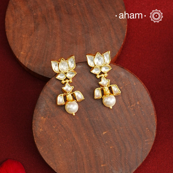 Stunning pair of Lotus Kundan earrings with pearl drop crafted in 92.5 silver. Perfect to wear at your friends engagement or for upcoming festivals.