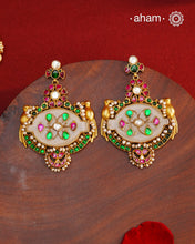 Fine Kundan work Earrings with delicate work and center stone setting with inlay work. Crafted in finest silver with gold polish, these are heirloom&nbsp;earrings that can be passed on for generations to come.