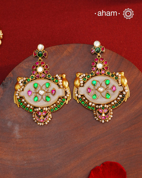Fine Kundan work Earrings with delicate work and center stone setting with inlay work. Crafted in finest silver with gold polish, these are heirloom&nbsp;earrings that can be passed on for generations to come.