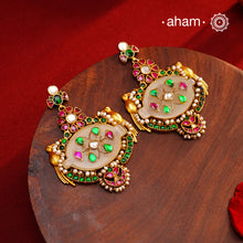 Fine Kundan work Earrings with delicate work and center stone setting with inlay work. Crafted in finest silver with gold polish, these are heirloom earrings that can be passed on for generations to come.