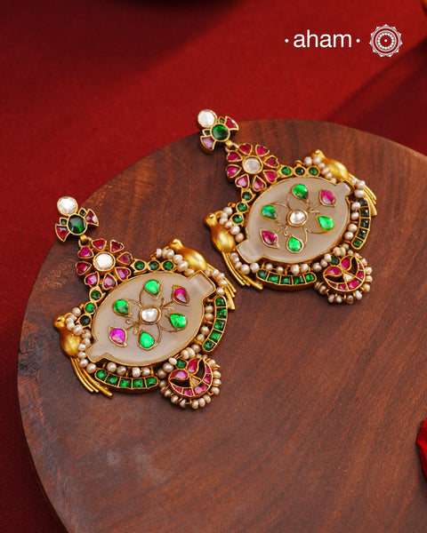 Fine Kundan work Earrings with delicate work and center stone setting with inlay work. Crafted in finest silver with gold polish, these are heirloom&nbsp;earrings that can be passed on for generations to come.