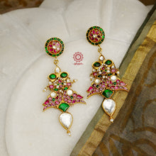 Fine Kundan work Earrings with delicate work. Crafted in finest silver with gold polish, these are heirloom earrings that can be passed on for generations to come. 