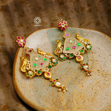 Fine Kundan work Earrings with delicate work and center stone setting with inlay work. Crafted in finest silver with gold polish, these are heirloom earrings that can be passed on for generations to come. 