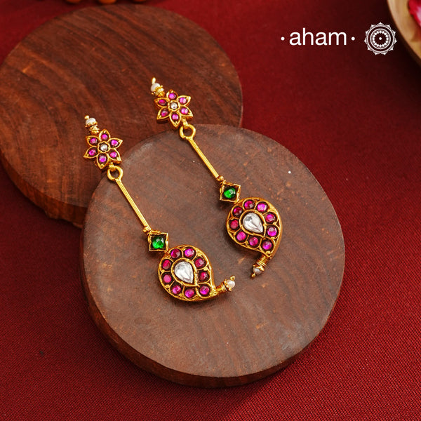 Handcrafted silver paisley earrings with gold polish and rani pink kundan work. Lightweight dainty earrings perfect for special occasions and upcoming festivities.