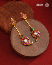 Handcrafted silver paisley earrings with gold polish and rani pink kundan work. Lightweight dainty earrings perfect for special occasions and upcoming festivities.