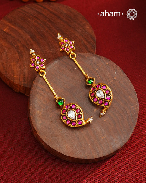 Handcrafted silver paisley earrings with gold polish and rani pink kundan work. Lightweight dainty earrings perfect for special occasions and upcoming festivities.