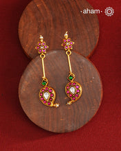 Handcrafted silver paisley earrings with gold polish and rani pink kundan work. Lightweight dainty earrings perfect for special occasions and upcoming festivities.
