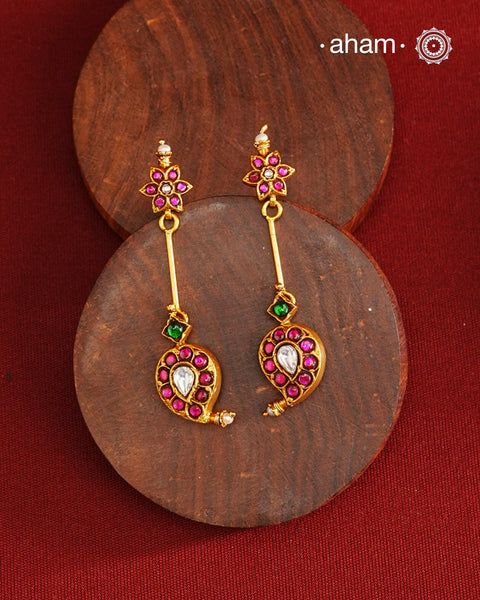 Handcrafted silver paisley earrings with gold polish and rani pink kundan work. Lightweight dainty earrings perfect for special occasions and upcoming festivities.