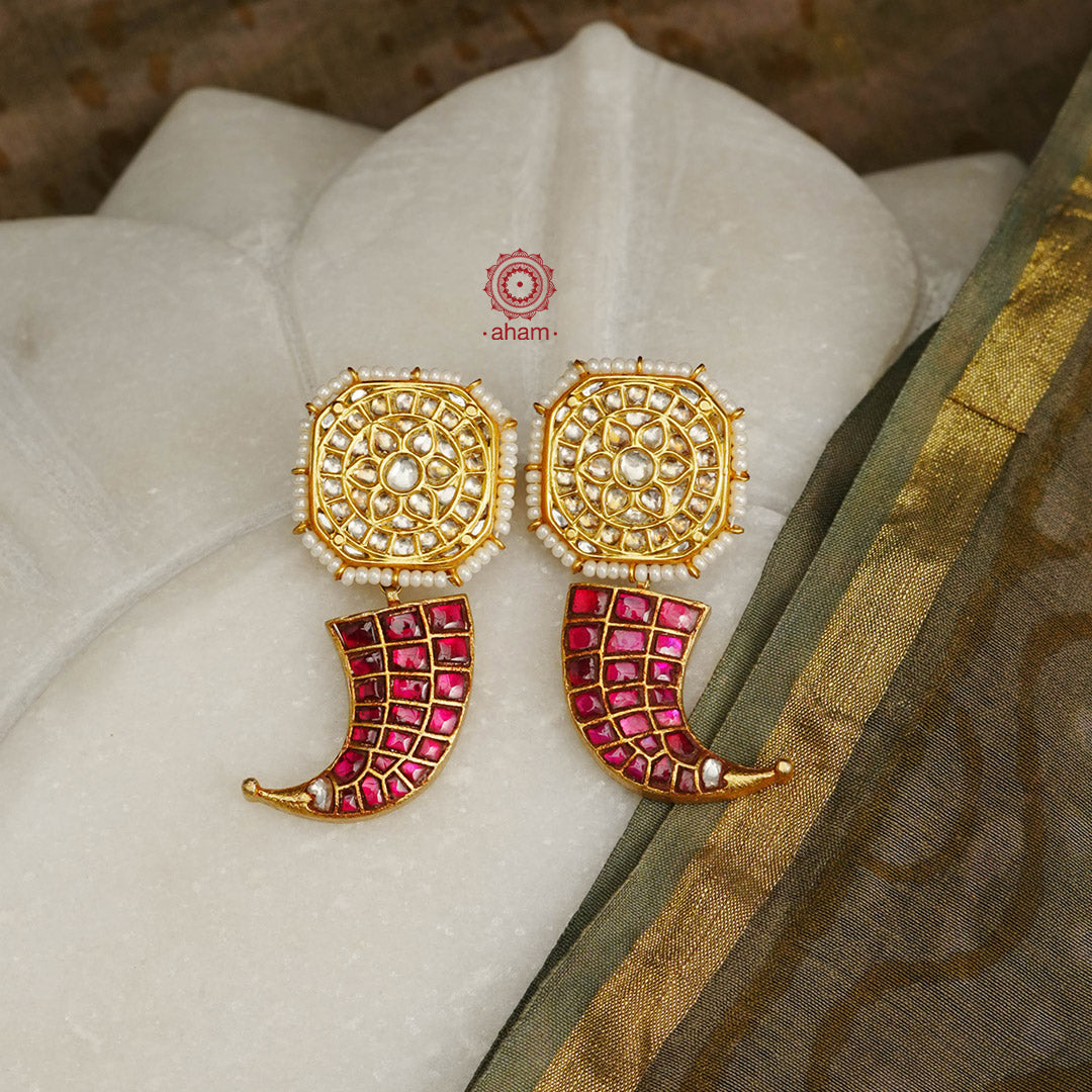 Beautiful and unique tiger call earrings with kundan tops. Crafted in 92.5 silver with gold polish. Make a statement with these stunning earrings. 