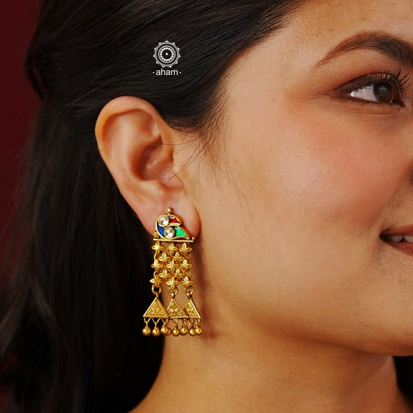 Handcrafted silver jhalar earrings with gold polish and bird motif stud. Pair these lightweight earrings with your favourite ethnic outfit to complete the look.