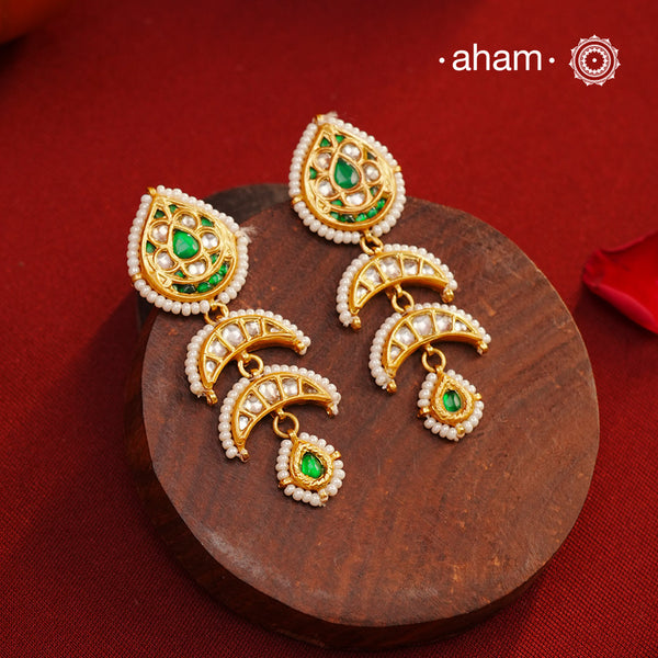 Handcrafted green and kundan drop 92.5 sterling silver earrings with gold polish. Lightweight earrings perfect for special occasions and festivities.