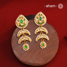 Handcrafted green and kundan drop 92.5 sterling silver earrings with gold polish. Lightweight earrings perfect for special occasions and festivities.