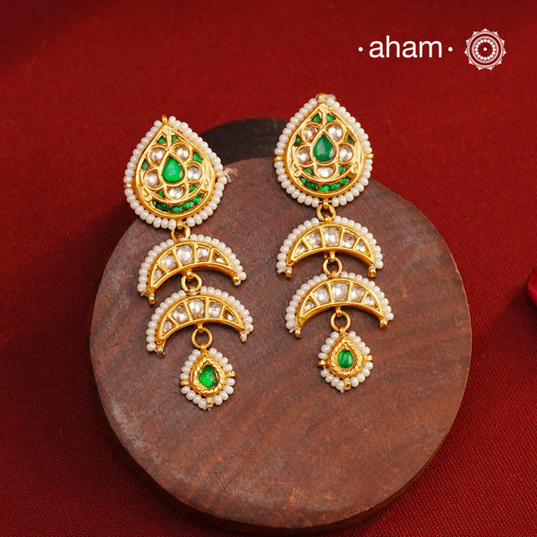 Handcrafted green and kundan drop 92.5 sterling silver earrings with gold polish. Lightweight earrings perfect for special occasions and festivities.