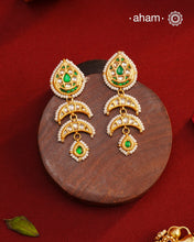 Handcrafted green and kundan drop 92.5 sterling silver earrings with gold polish. Lightweight earrings perfect for special occasions and festivities.
