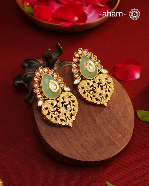 Handcrafted rose quartz silver earrings with gold polish. Lightweight earrings perfect for special occasions and gifting.