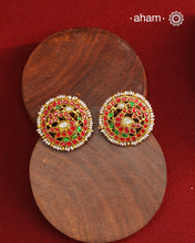 Feel like royalty when dressed in these gold polish peacock studs. Elegant earrings handcrafted in 92.5 sterling silver with deep red coloured kundan work. This pair is perfect for special occasions and festivities.