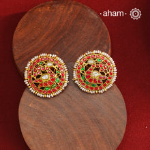 Feel like royalty when dressed in these gold polish peacock studs. Elegant earrings handcrafted in 92.5 sterling silver with deep red coloured kundan work. This pair is perfect for special occasions and festivities.