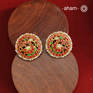 Feel like royalty when dressed in these gold polish peacock studs. Elegant earrings handcrafted in 92.5 sterling silver with deep red coloured kundan work. This pair is perfect for special occasions and festivities.