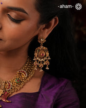 Add a touch of elegance to any outfit with these traditional chandelier-style Kundan gold polish silver earrings. Crafted with 92.5 silver and finished with gold polish, Kundan and pearl highlights, they are the perfect piece to go with any festive occasion.