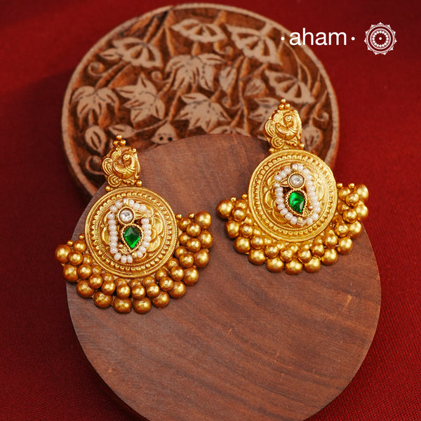 These beautiful Festive Gold Polish Silver Earrings are expertly handcrafted in 92.5 silver and plated in a stunning dull gold finish. Perfect for adding a touch of elegance to any festive occasion, these earrings are a must-have for any jewelry collection.