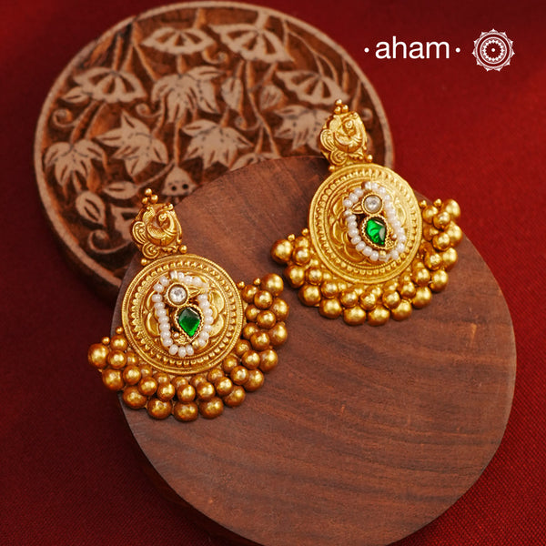 These beautiful Festive Gold Polish Silver Earrings are expertly handcrafted in 92.5 silver and plated in a stunning dull gold finish. Perfect for adding a touch of elegance to any festive occasion, these earrings are a must-have for any jewelry collection.