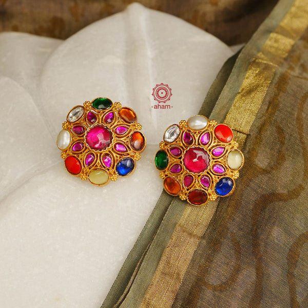 Gorgeous Navratna Earrings crafted in silver, dipped in gold polish.  This pair is perfect for special occasions and festivities. If you are a jewellery connoisseur, one Navratna earring set in your collection is must. 