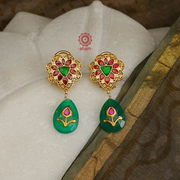 Detailed Kundan earrings with a beautiful green inlay work green drop.  Crafted in 92.5 sterling silver with Gold polish.  Perfect for festivities and occassions. 