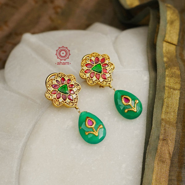 Detailed Kundan earrings with a beautiful green inlay work green drop.  Crafted in 92.5 sterling silver with Gold polish.  Perfect for festivities and occassions. 