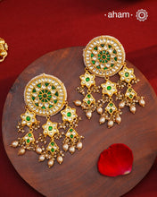 Elevate your style with our Festive Green Kundan Gold Polish Silver Earrings. These magnificent statement earrings feature detailed kundan work and delicate pearls, all crafted in 92.5 silver.&nbsp;These showstopper earrings are all you need&nbsp;for your next big occasion.
