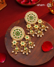 Elevate your style with our Festive Green Kundan Gold Polish Silver Earrings. These magnificent statement earrings feature detailed kundan work and delicate pearls, all crafted in 92.5 silver.&nbsp;These showstopper earrings are all you need&nbsp;for your next big occasion.