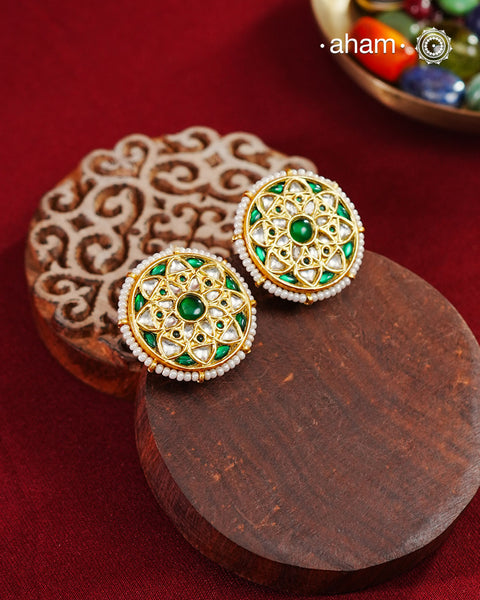 Festive gold polish studs&nbsp;with vibrant floral work. Handcrafted in 92.5 sterling&nbsp;silver using jadau kundan techniques. Perfect for special occasions, pair these floral&nbsp;earrings with your favorite ethnic outfits.