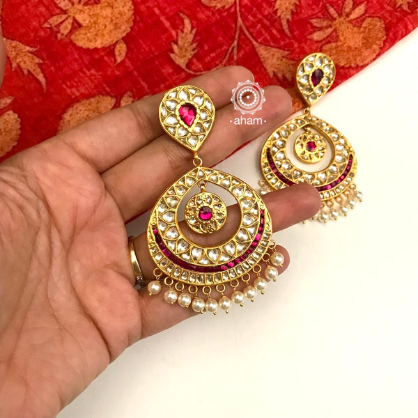 Statement gold polish chandbali earring with beautiful pearl hangings. Handcrafted using traditional methods in 92.5 sterling silver and dipped in gold polish. Pair these with your ethnic outfits this festive season to ace your look.