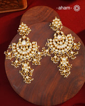 Statement gold polish chandbali earring with little hanging pearls. Handcrafted using traditional methods in 92.5 sterling silver and platted in gold. Pair these with your ethnic outfits this festive season to ace your look.