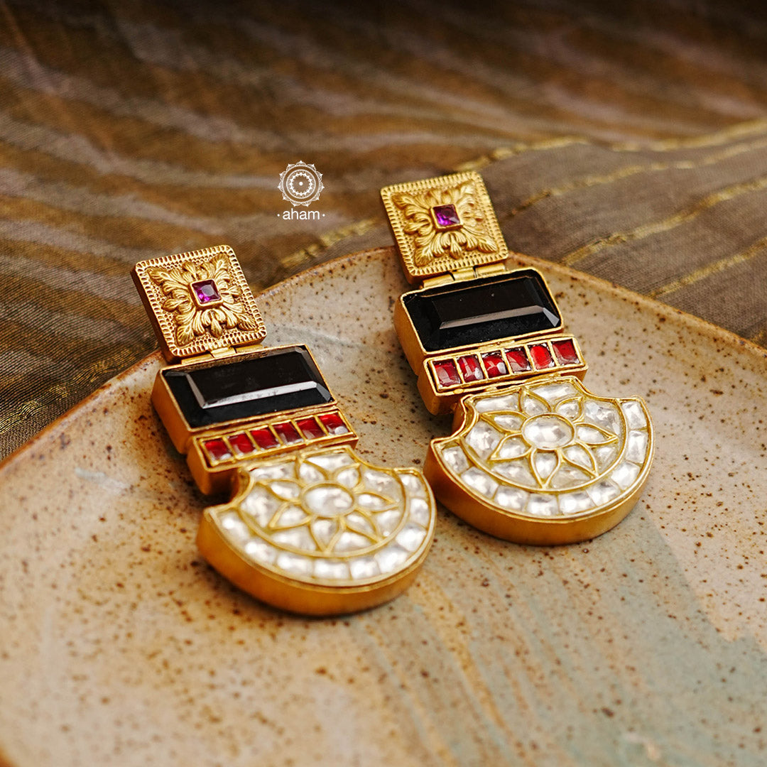 Statement gold polish chandbali earring with multiple mini dangling jhumkies. Handcrafted using traditional methods in 92.5 sterling silver with cultured pearls. Pair these with your ethnic outfits this festive season to ace your look.