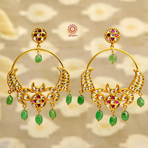 Statement gold polish chandbali earring with stunning kundan work. Handcrafted using traditional methods in 92.5 sterling silver with beautiful green drops. Pair these with your ethnic outfits this festive season to ace your look.