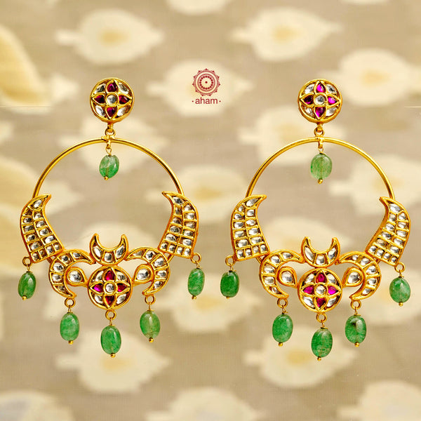 Statement gold polish chandbali earring with stunning kundan work. Handcrafted using traditional methods in 92.5 sterling silver with beautiful green drops. Pair these with your ethnic outfits this festive season to ace your look.